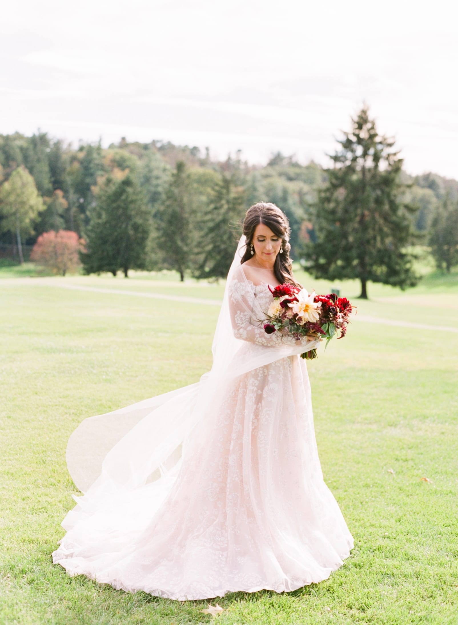 Biltmore Forest Country Club bridal photos on a golf course with long veil photo