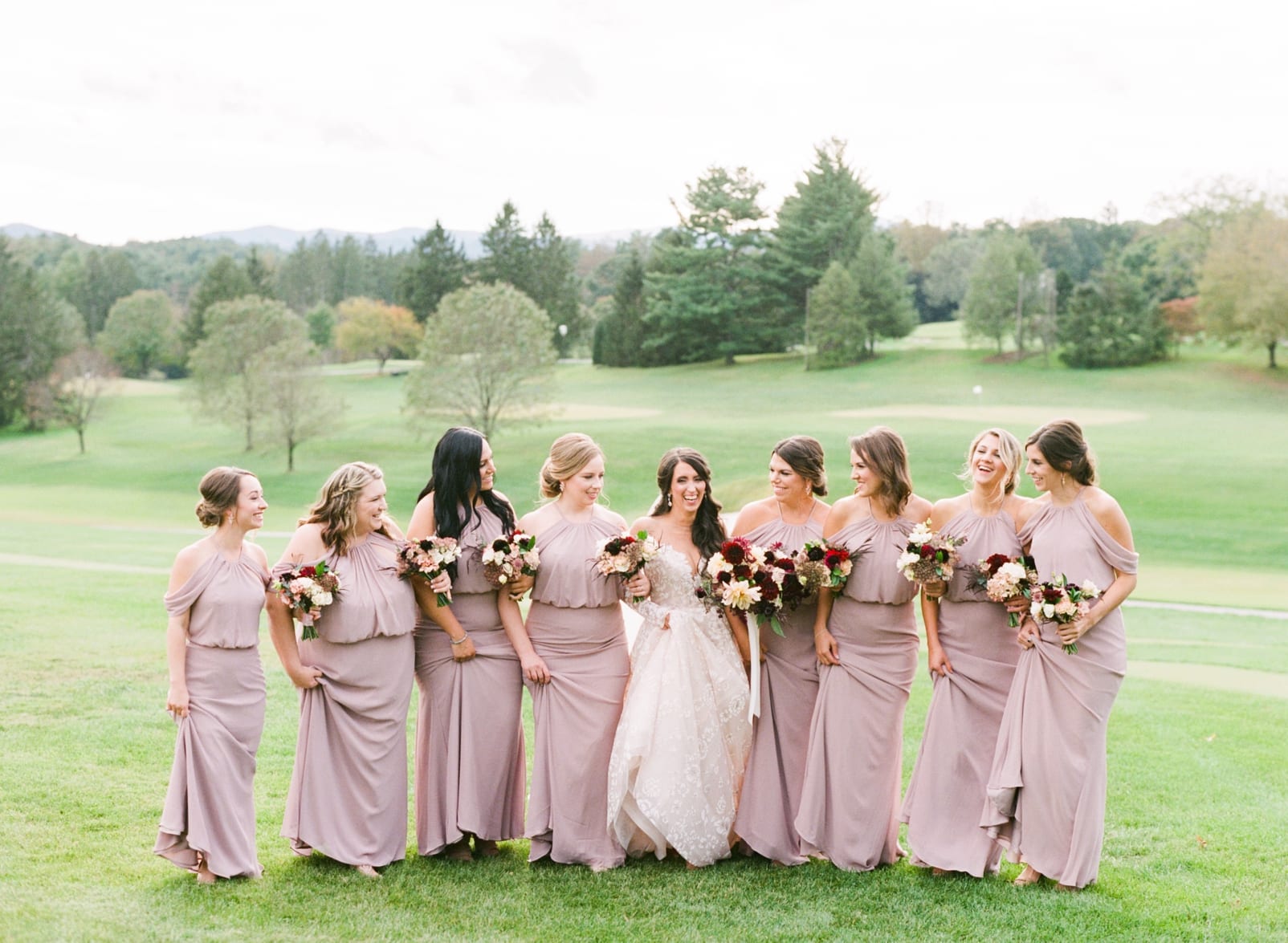 Biltmore Forest Country Club bridesmaids in long blush pink gowns walking with the bride photo