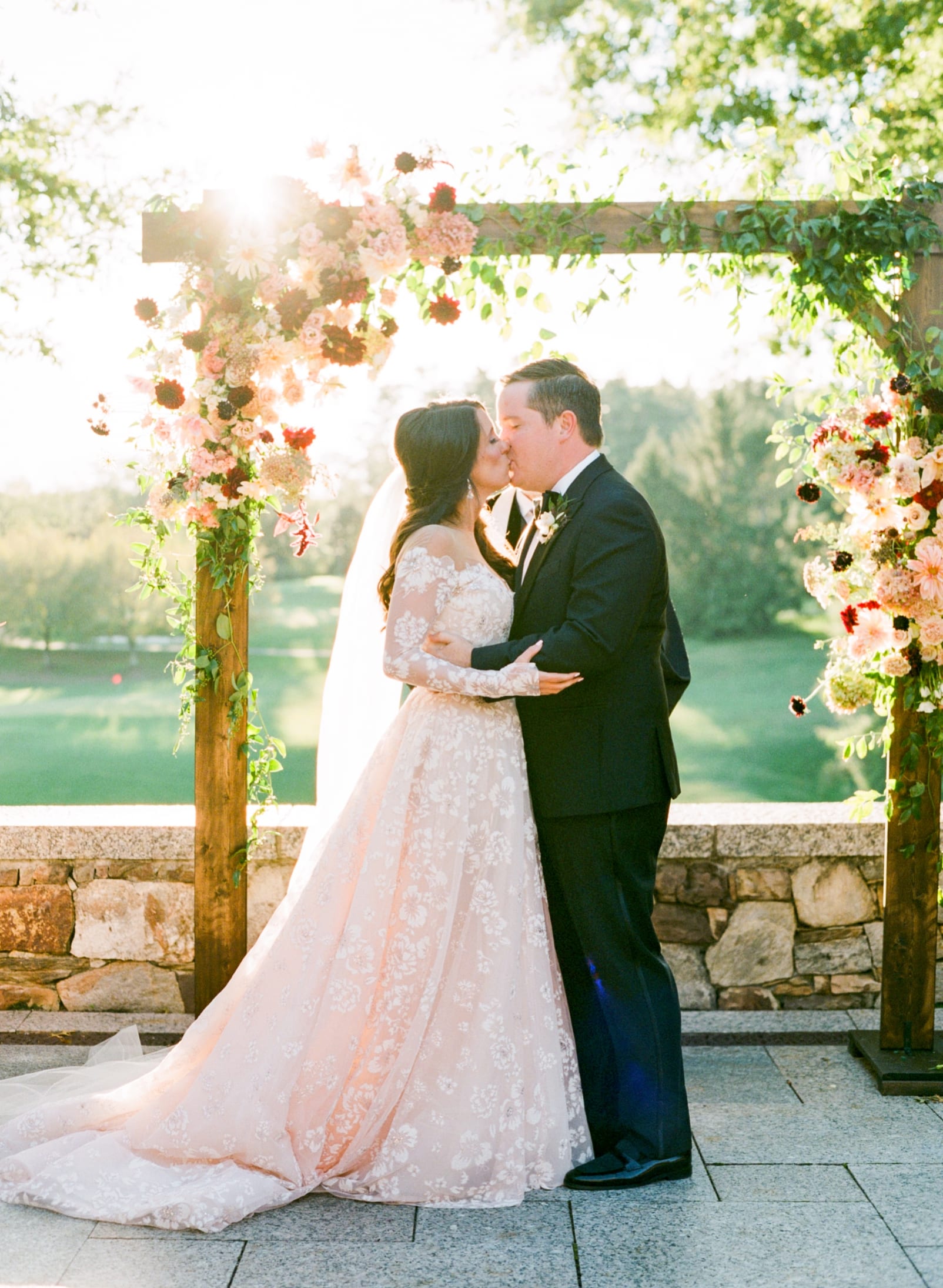 Biltmore Forest Country Club bride and groom first kiss during wedding ceremony photo