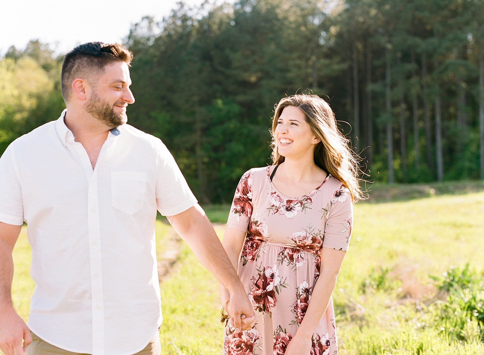 Raleigh engagement session girl in a short sleeve maxi dress that is light pink with flowers photo
