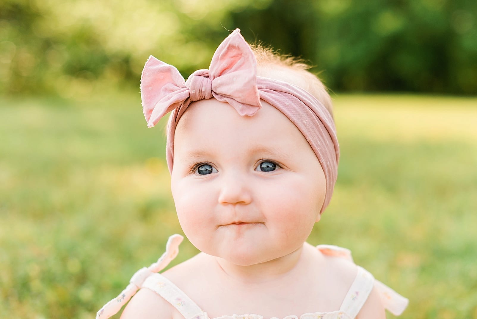 Raleigh baby in a blush pink headband photo
