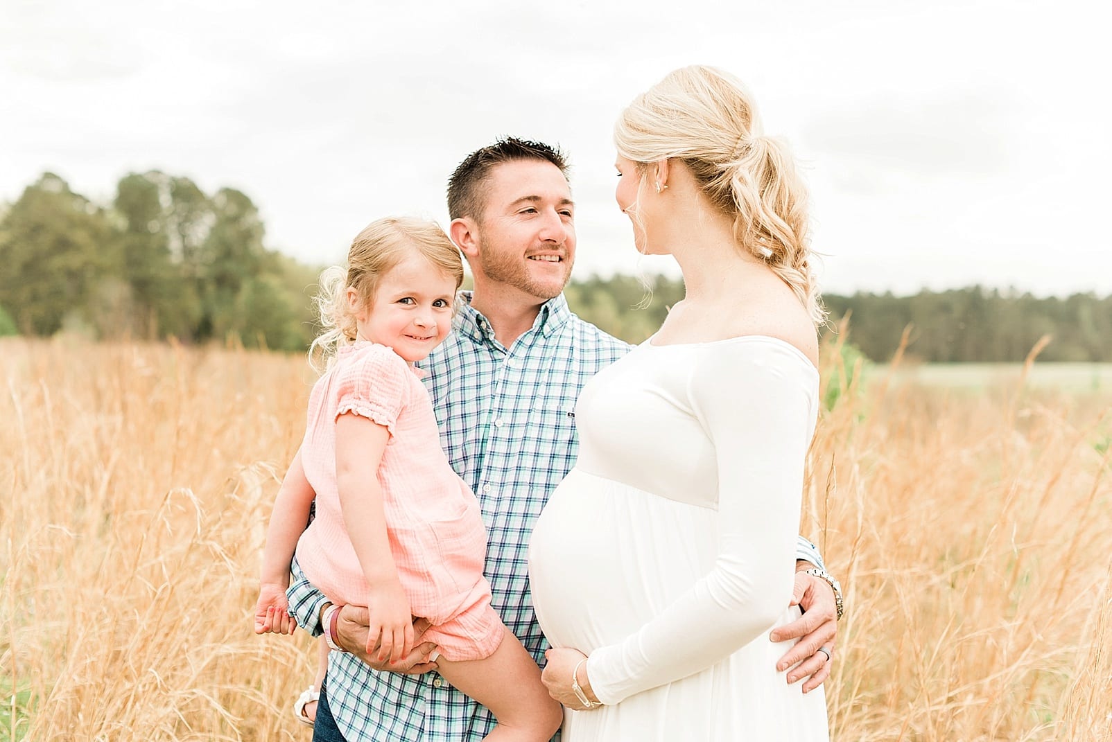 Wake Forest family of three snuggled in during maternity session photo
