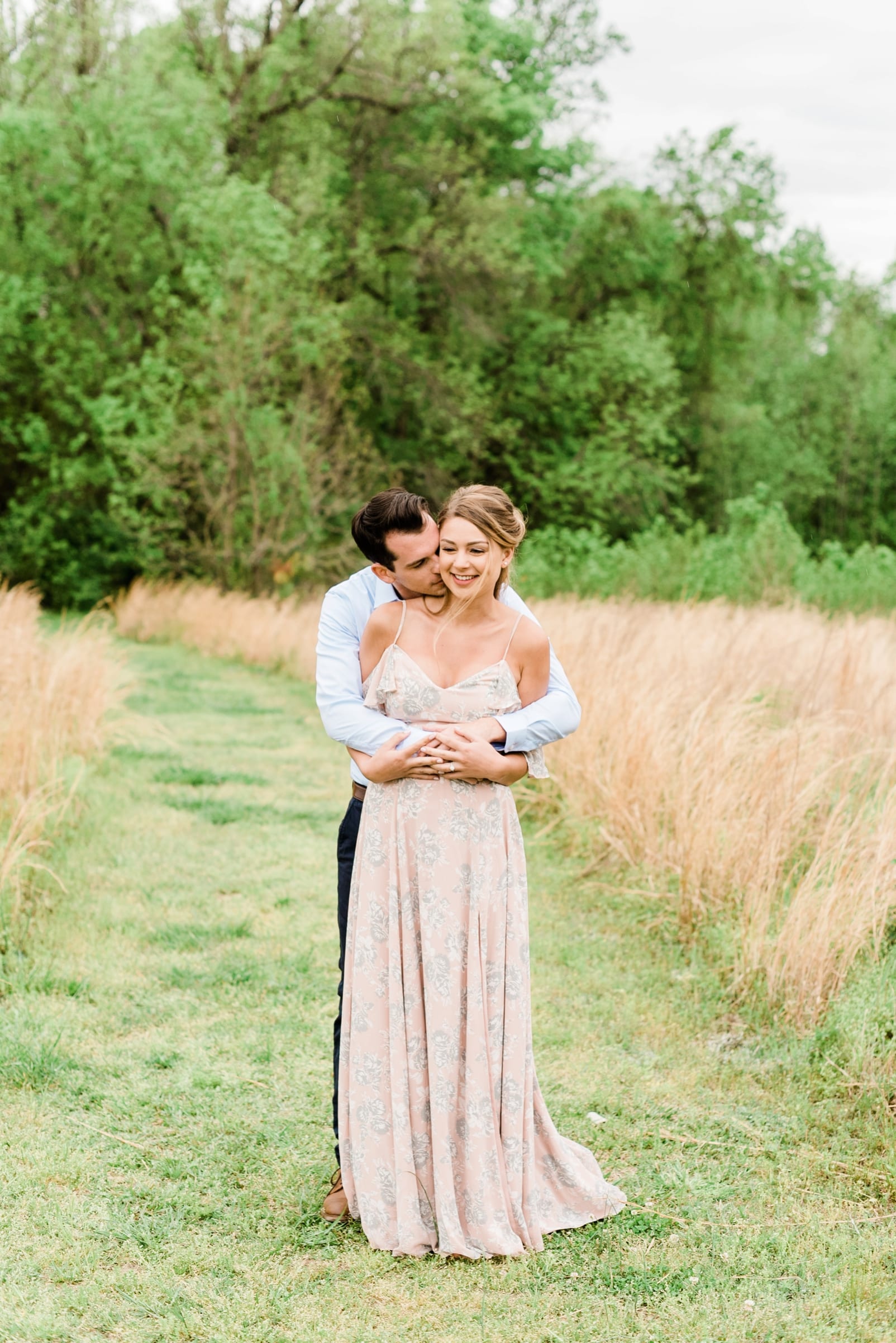 Raleigh engagement session groom snuggled around behind his bride photo