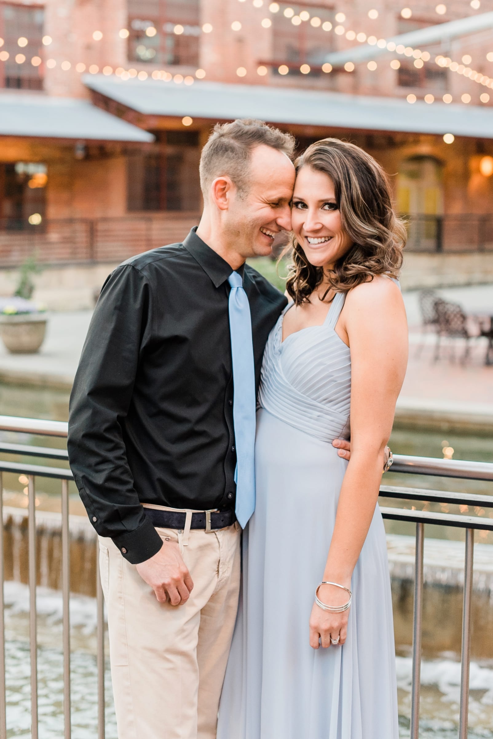 Durham engagement session with couple dressed up downtown photo