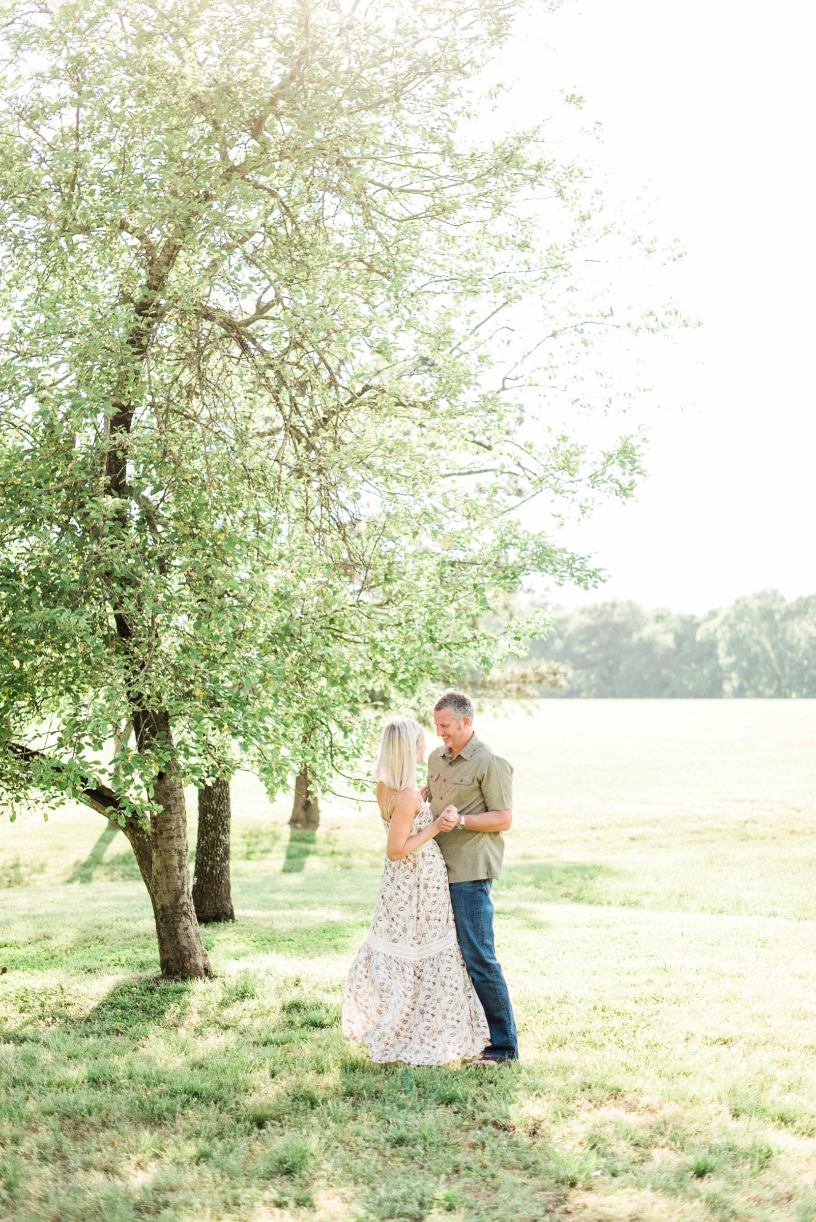 Wake Forest engagement couple dancing under a tree photo