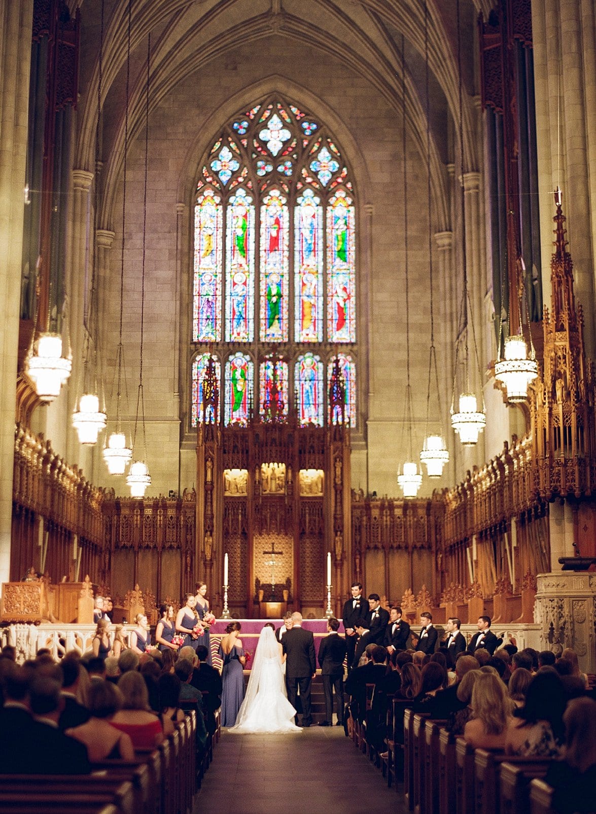 Duke Chapel wedding ceremony bride and groom standing together at the front of the room photo