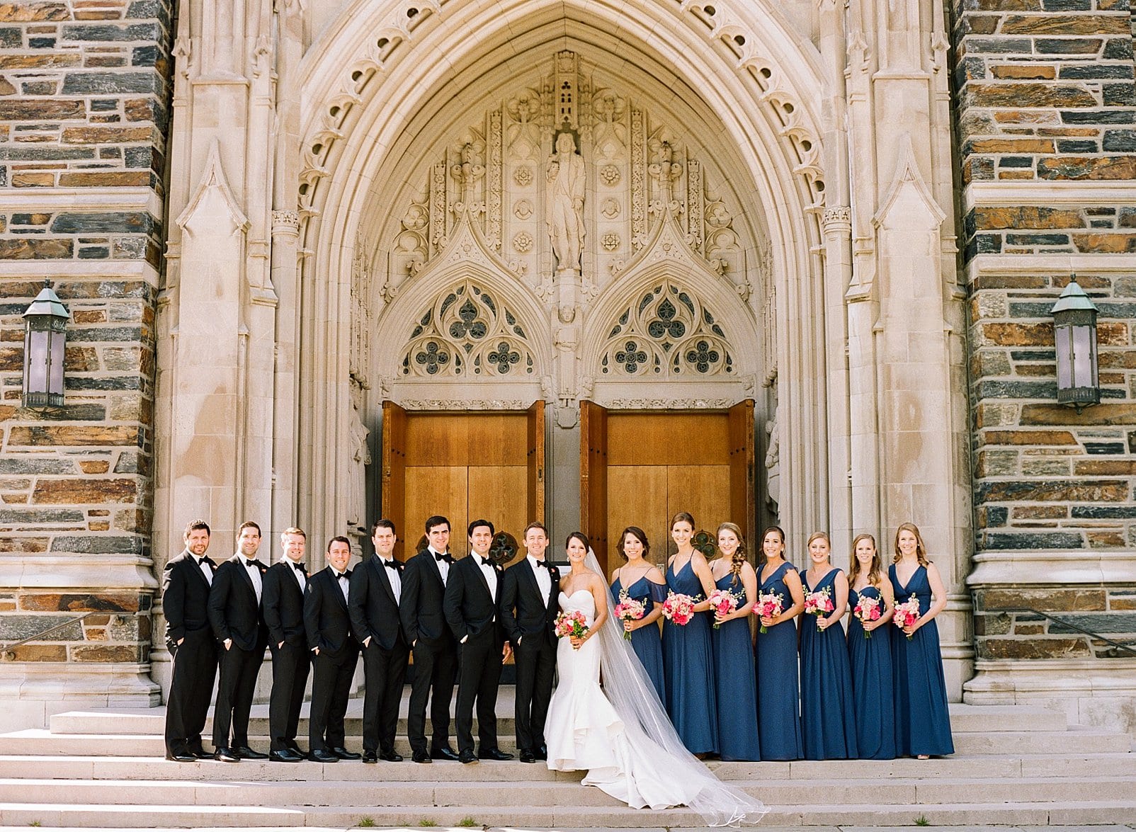 Duke Chapel bride and groom with wedding party outside in front of Duke Chapel photo