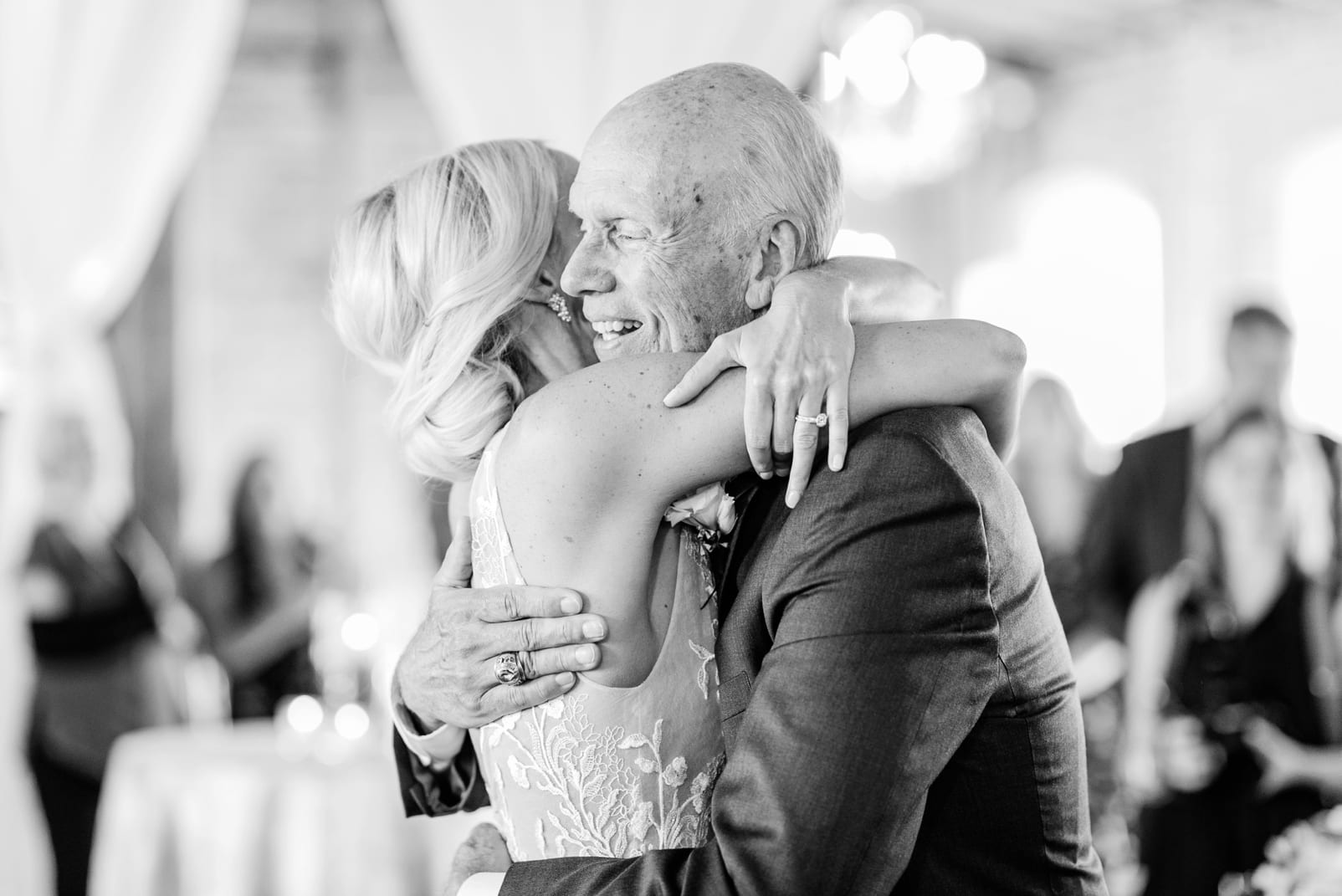 Raleigh bride hugging her father after their father daughter dance photo