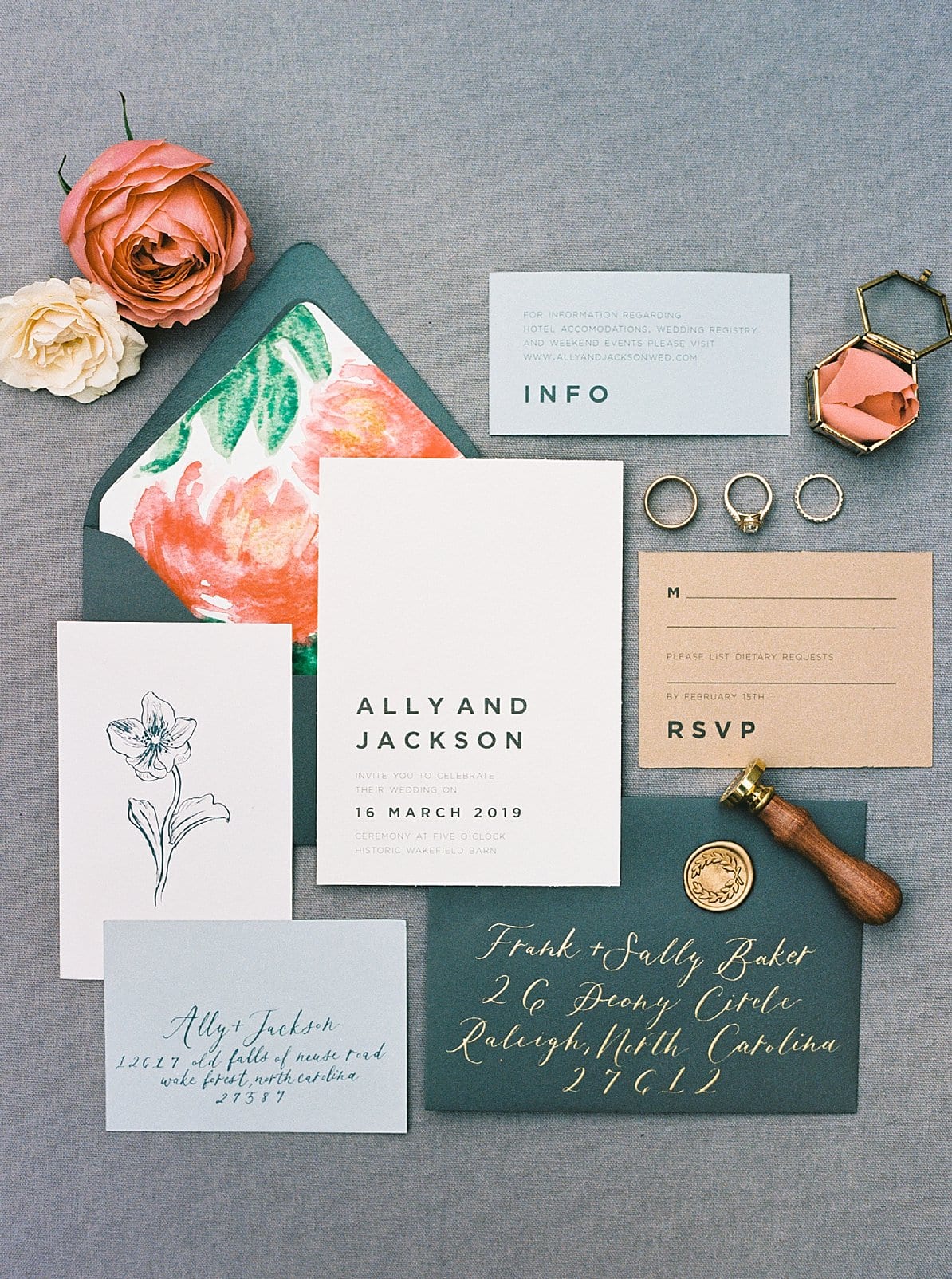 Mason Dixon designs dark green envelope with modern invitation styled with orange florals and a wax seal photo