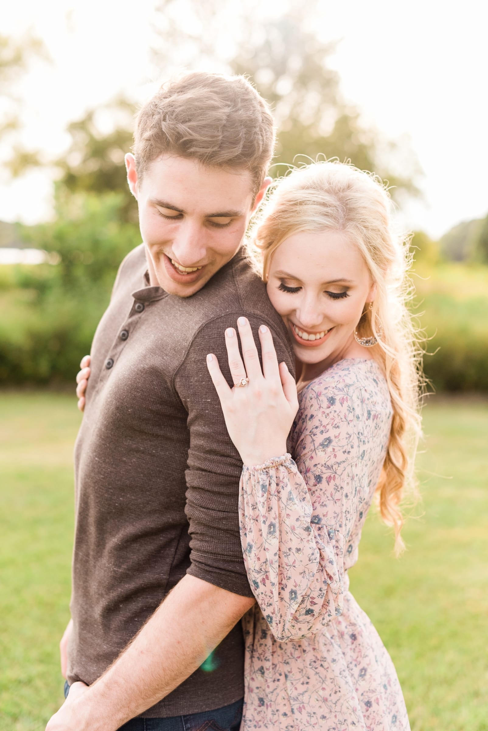 NC engaged couple laughing during their portraits photo