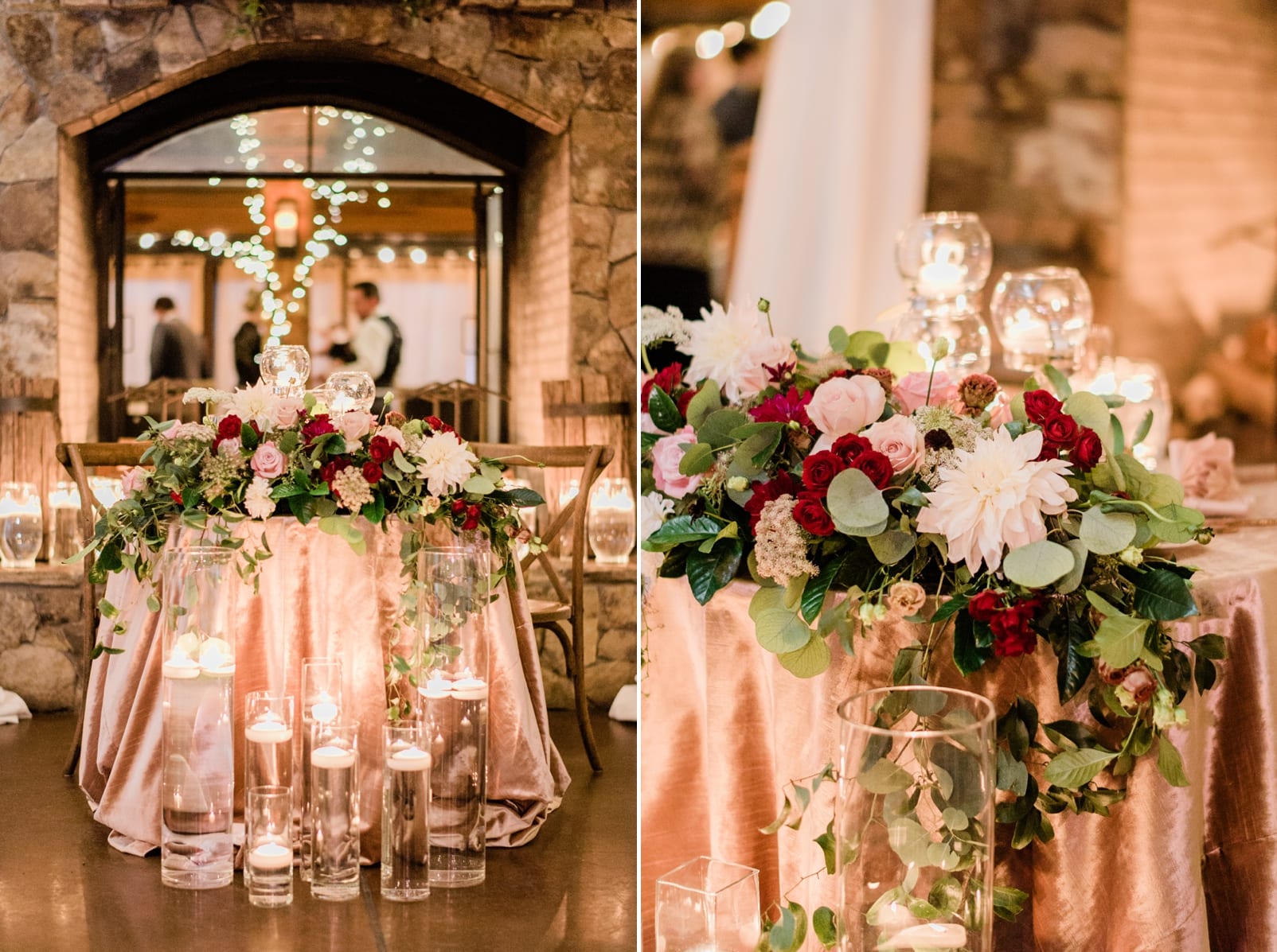 Angus Barn wedding reception sweetheart table with clear vases with floating candles and a cascading flower arrangement across the table photo