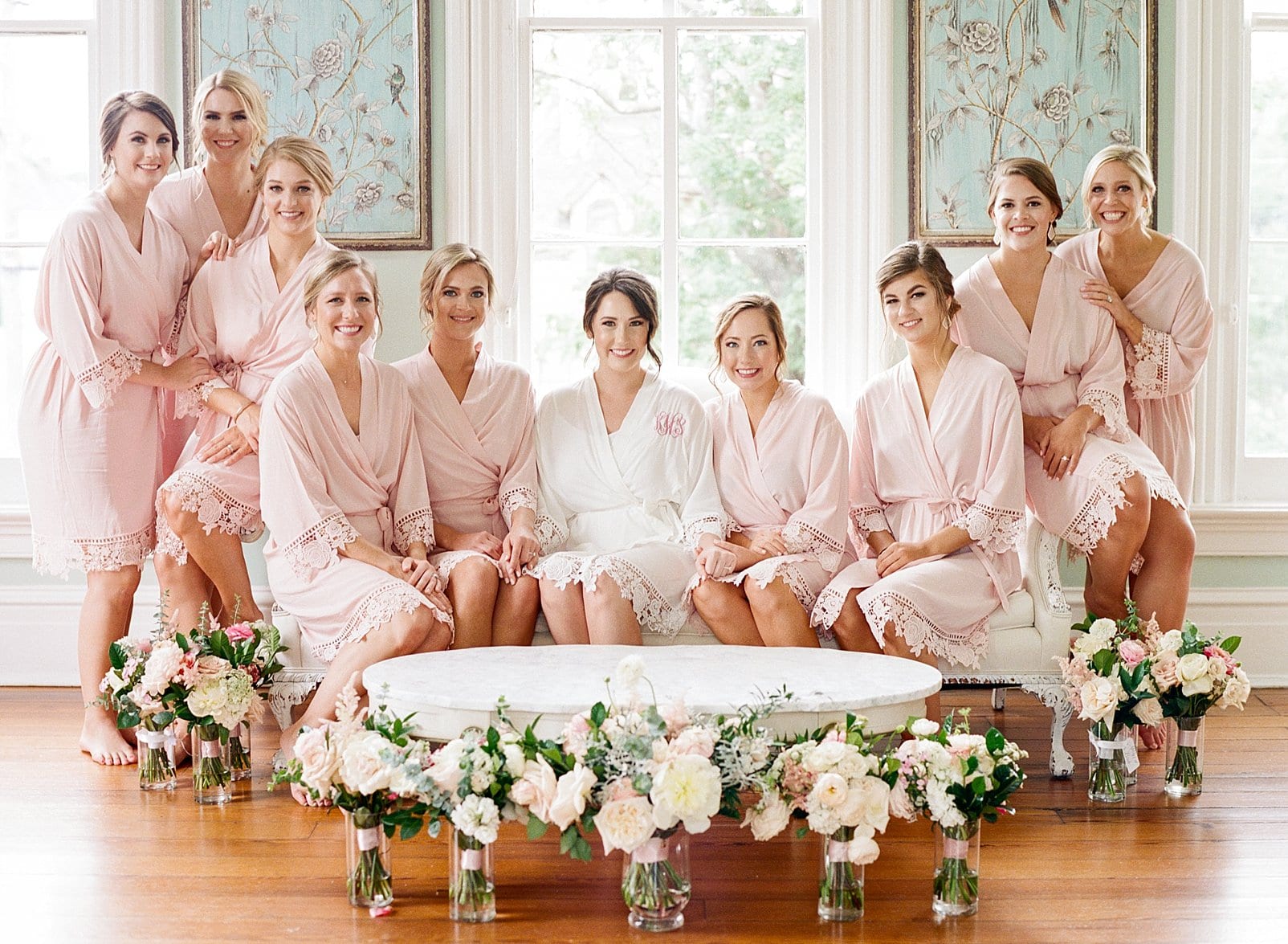 Merrimon Wynne bridesmaids and bride sitting together on the couch photo