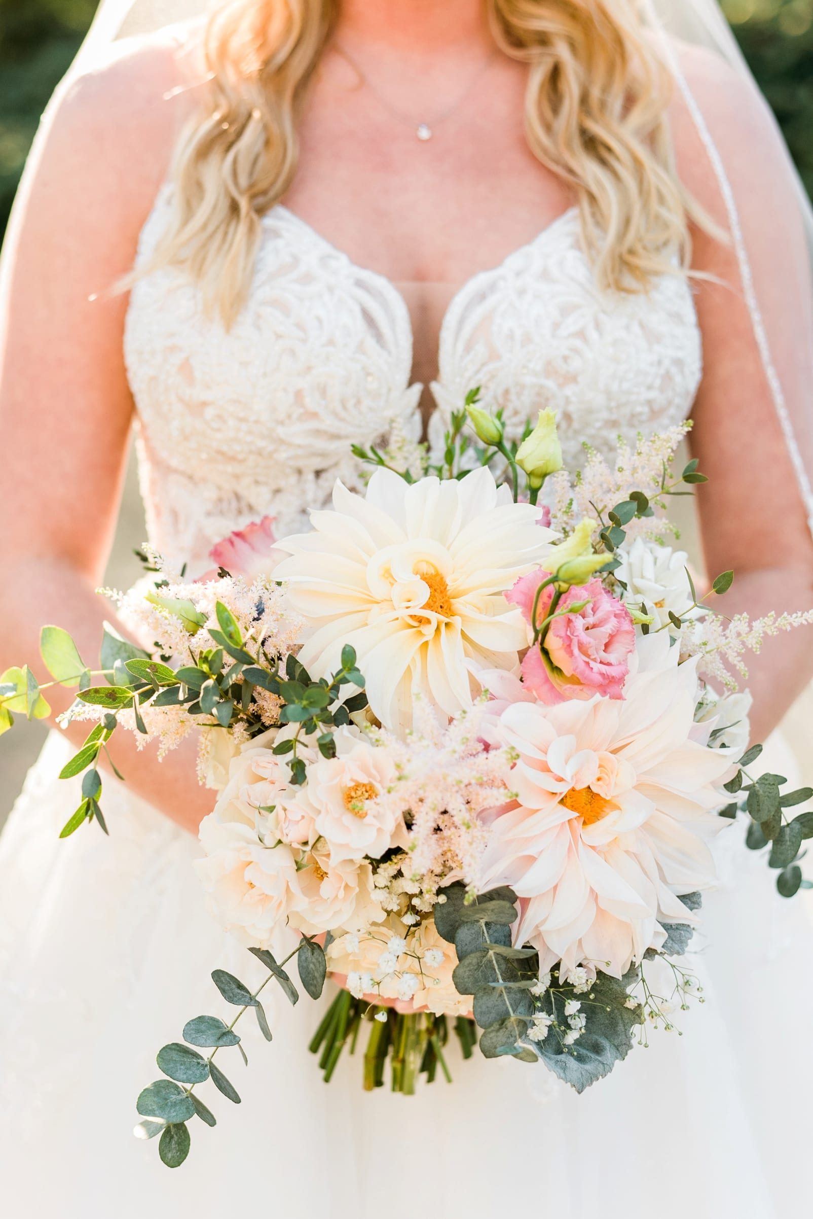 Flowers on Broad Street bridal bouquet with white and cream flowers and pops of light pink flowers photo