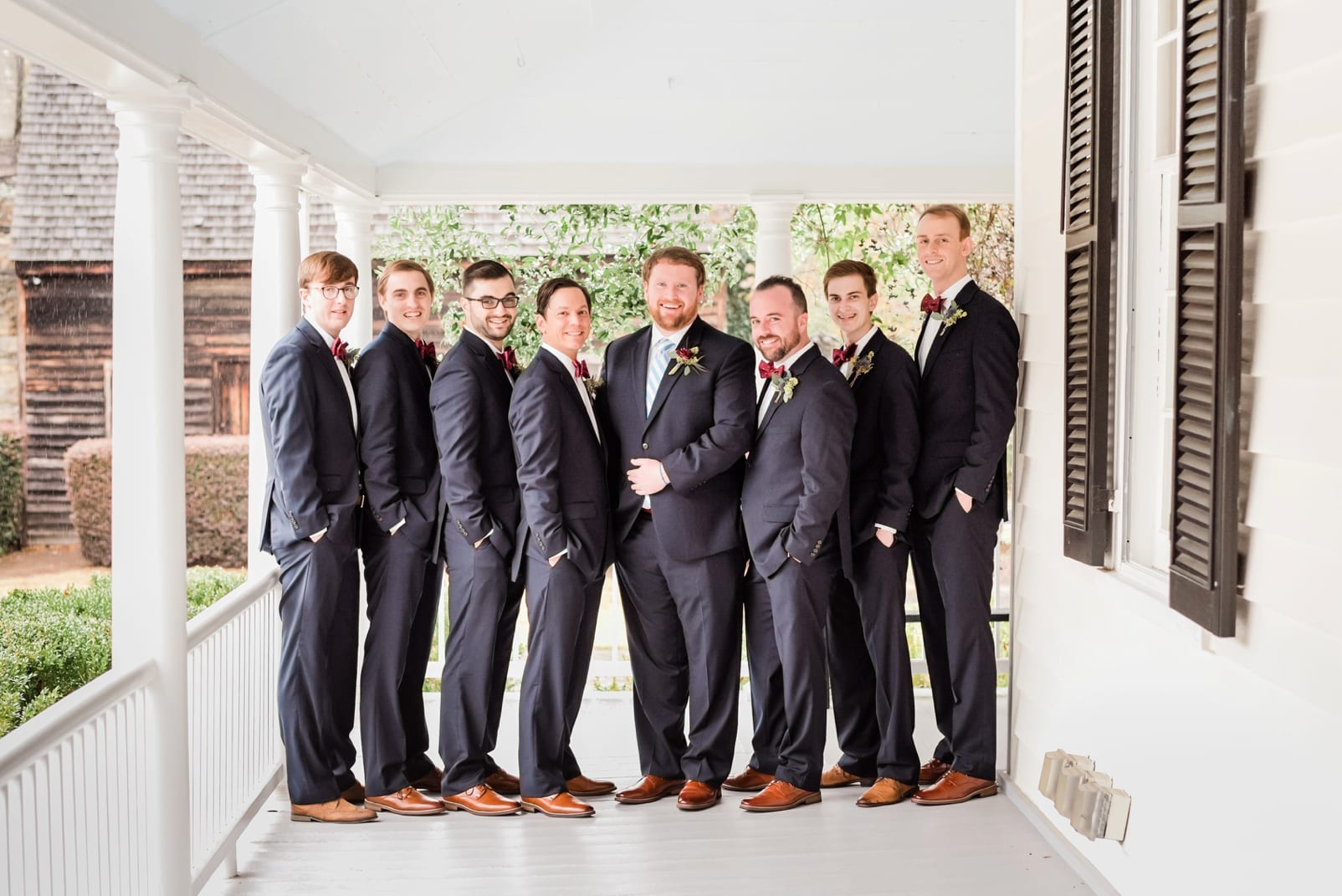 Sutherland Estate groom and groomsmen in black Jos A. Banks suits with light brown shoes photo
