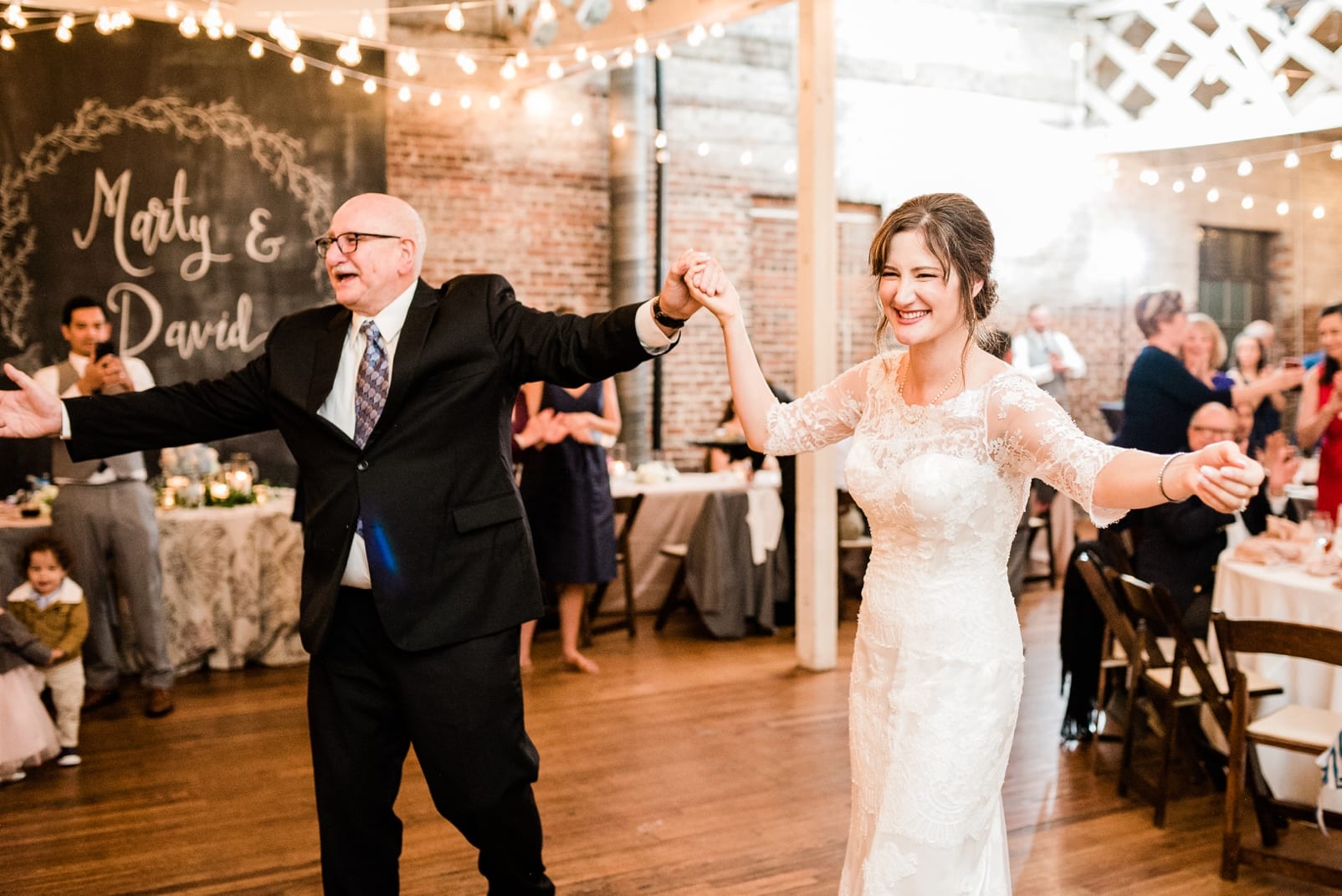 Stockroom at 230 bride dancing with her father photo