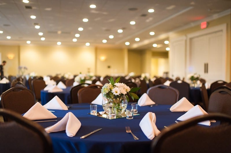 Reception tables with navy blue and hydrangeas- A.J. Dunlap Photography