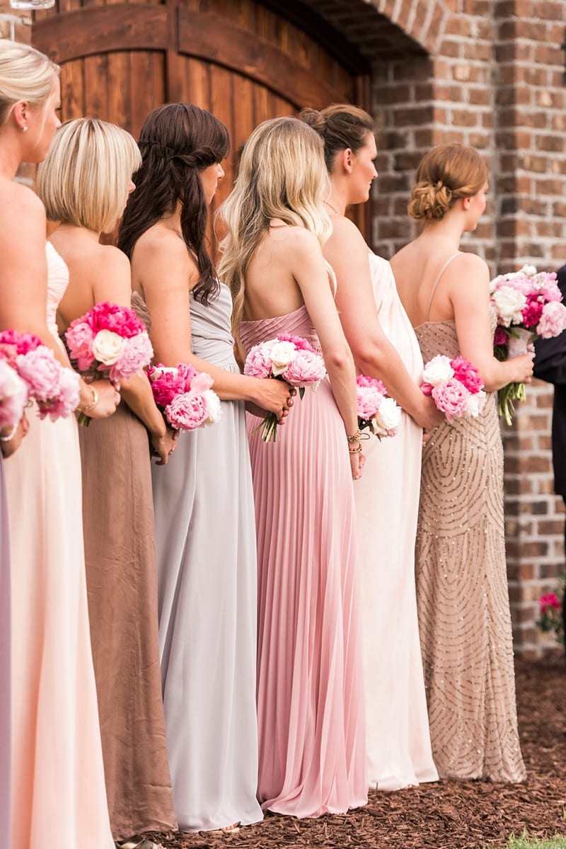 Pink peonies, rustic touches, and mix matched bridesmaid dresses make this Apex, NC spring wedding beautiful.