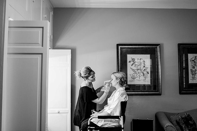 bride getting her makeup done photo