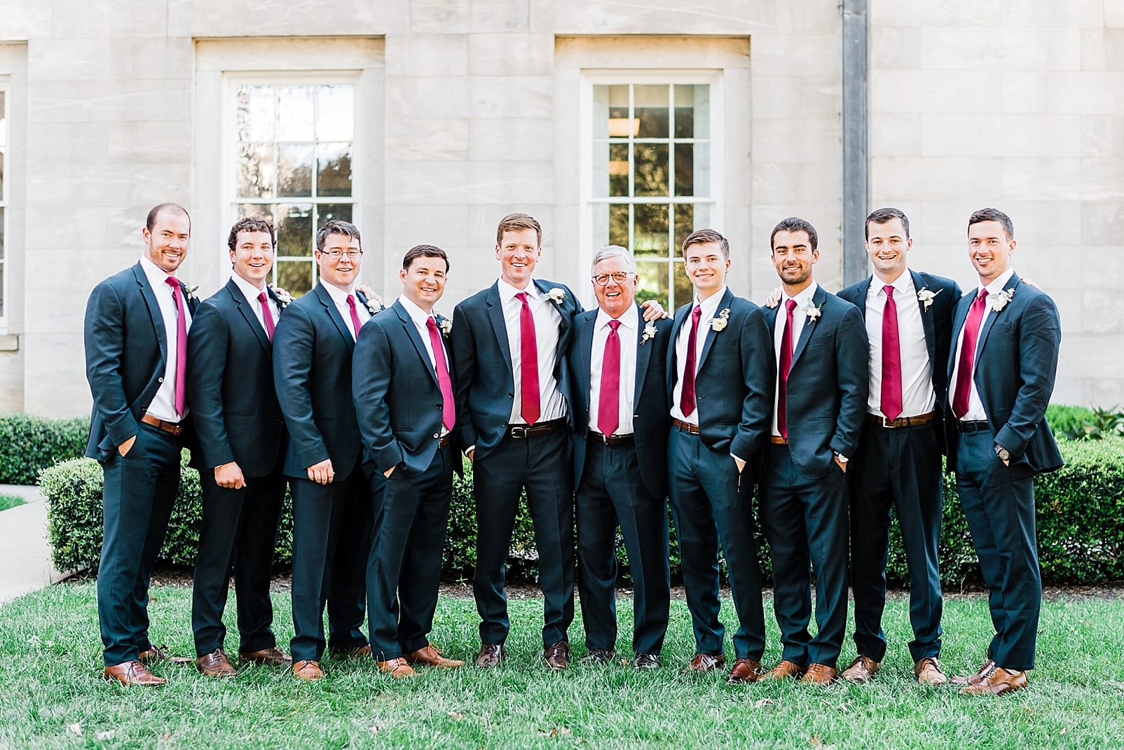 north carolina wedding photographer groomsmen portraits burgundy ties capitol building raleigh photo