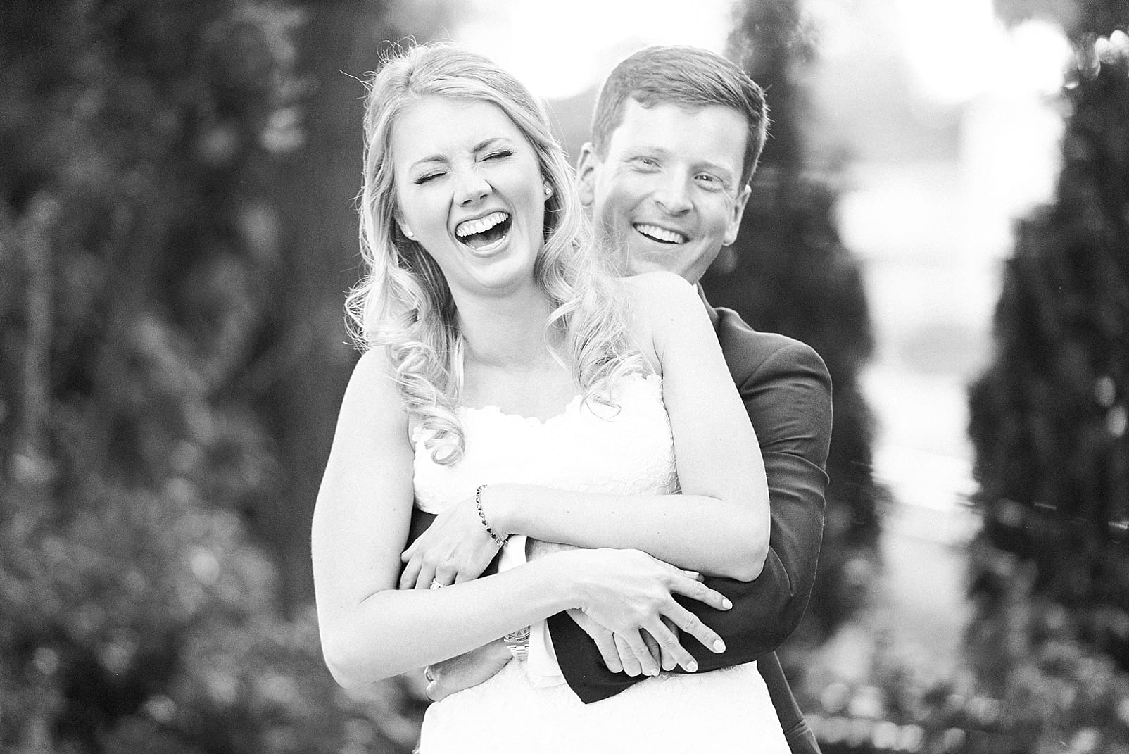 melrose knitting mill wedding photographer raleigh industrial wedding bride and groom laughing photo