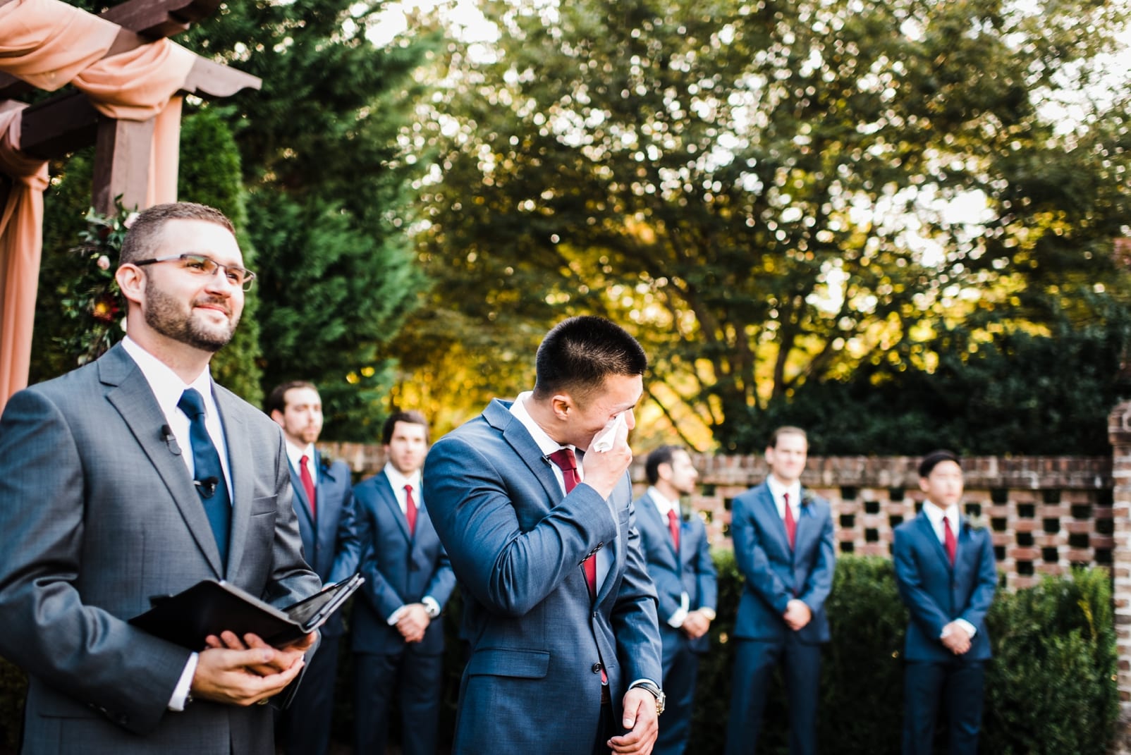 sutherland estate wedding photographer groom crying groom seeing bride groom in navy suit photo