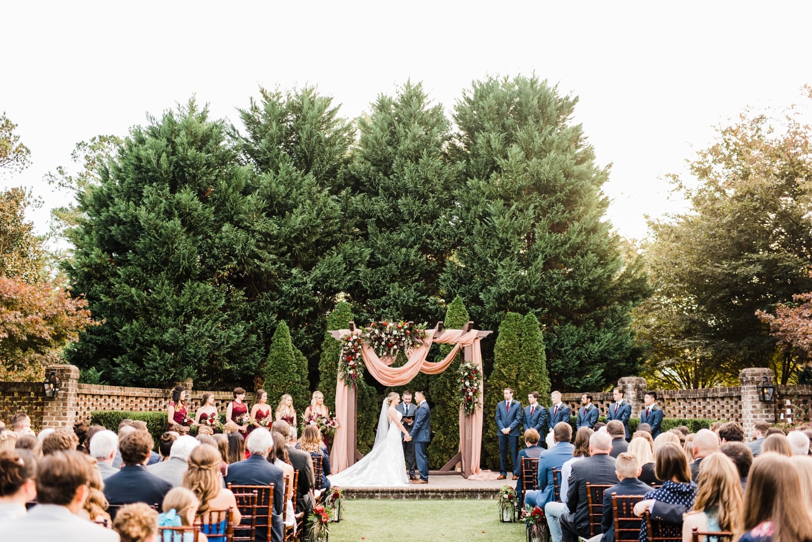 sutherland estate and gardens wedding photographer ceremony inspiration mauve wedding inspiration arbor with fabric draping photo