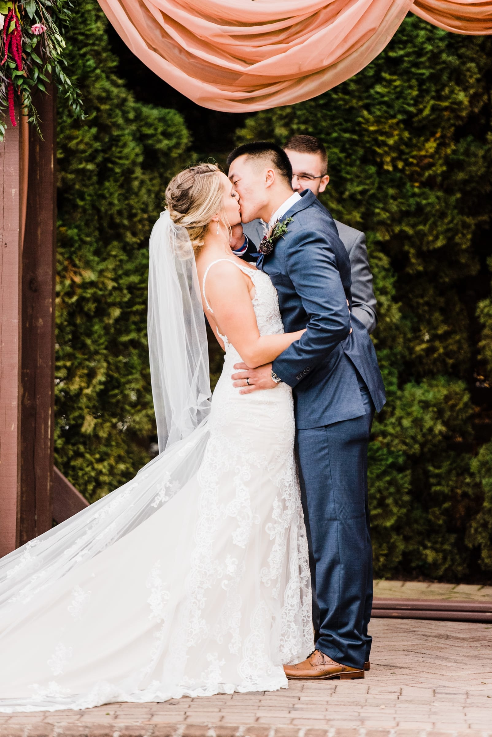 sutherland estate and gardens wedding photographer first kiss wedding dress inspiration ceremony with floral arbor photo