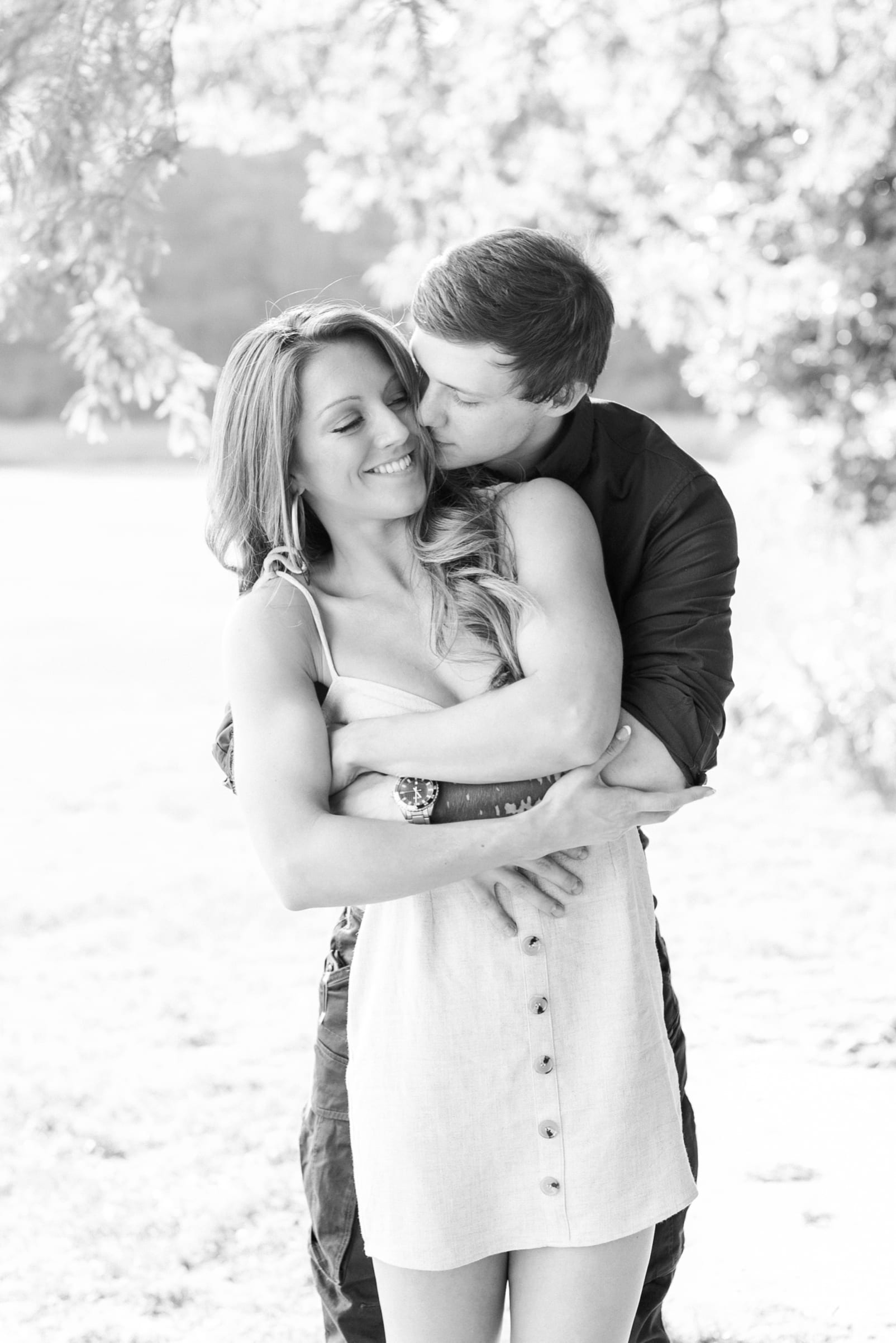 Raleigh couple snuggled together during engagement pictures photo