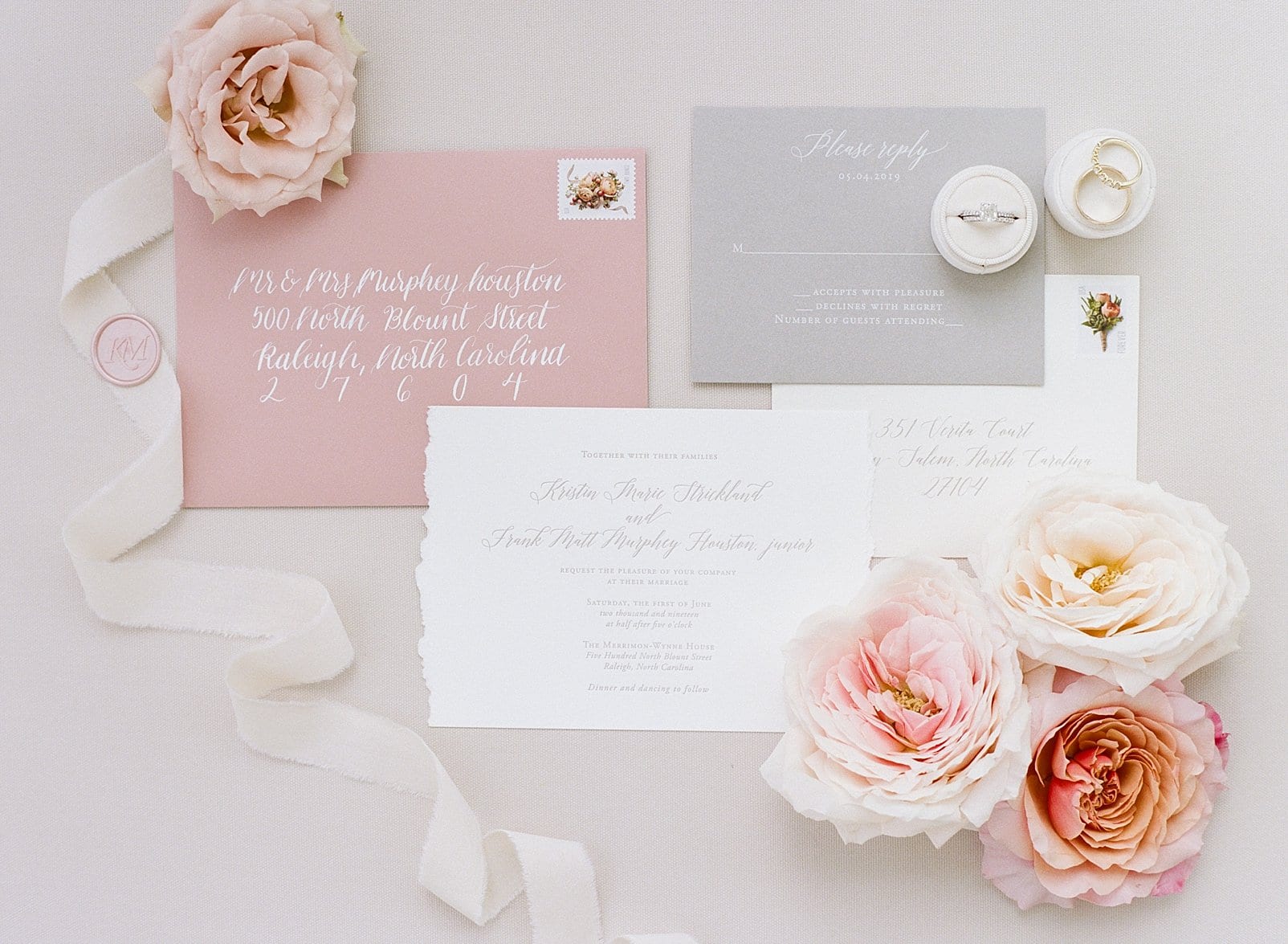 One and Only Paper landscape wedding invitation on white paper with a blush colored envelope photo